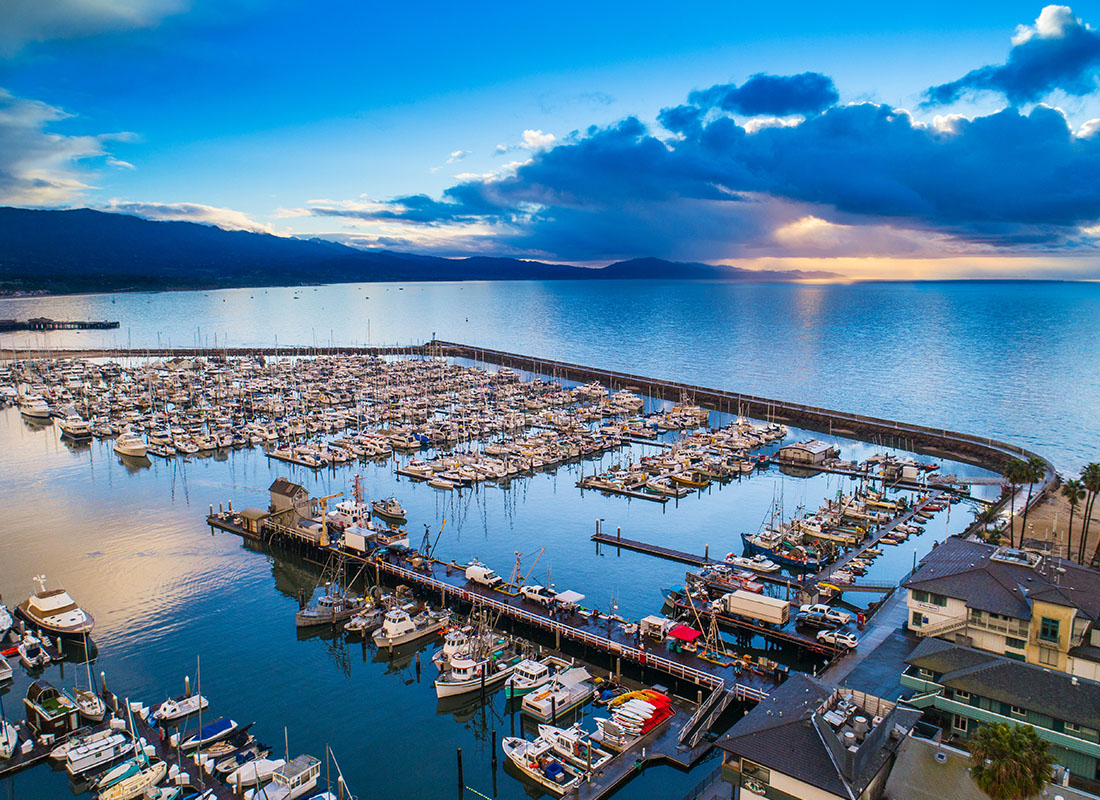 Service Center - Aerial View of a Boat Dock in Santa Barbara California with Clouds in the Sky at Sunset
